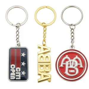 China Manufacturer Custom Company Logo Wholesale Metal Personalized Key Chain 3D Cute Keyring Cheap Letter Soft Enamel Keychains