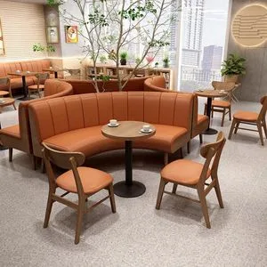 Modern Commercial Restaurant Furniture Featuring Orange Leather Upholstered Curved Booth Seating Wood Table Black Metal Base and Matching Chairs for Cafe Shop.